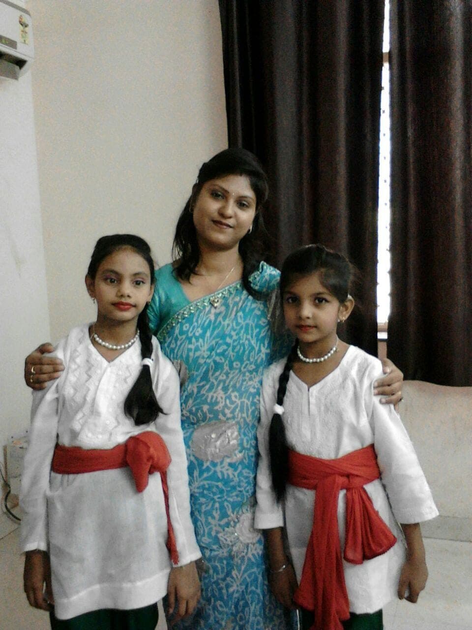 Choreographer with two students dressed for a stage performance